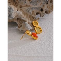 Aretha Orange Stud Earrings Vibrant Personality: The orange hue reflects boldness, energy, and an unapologetic sense of self. These earrings are a tribute to individuality and confidence, offering a striking accessory that commands attention and radiates positivity. Striking Gemstone: The carefully chosen orange gemstone adds a radiant pop of color to your ensemble. The Aretha Orange Stud Earrings feature a captivating design that embodies the spirit of energy and creativity. The vibrant orange Trendy Orange Drop Earrings, Vibrant Orange Drop Earrings, Modern Orange Drop Earrings, Trendy Orange Dangle Earrings, Minimalist Orange Drop Earrings, Bold Orange Party Jewelry, Bold Drop Earrings Jewelry Gift, Orange Pierced Earrings As Gift, Orange Drop Earrings For A Gift