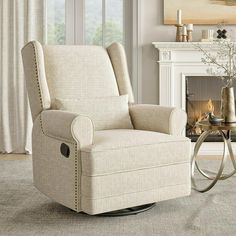 a living room with a chair, fireplace and window in it's centerpiece