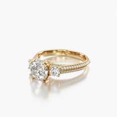 a yellow gold engagement ring with two diamonds