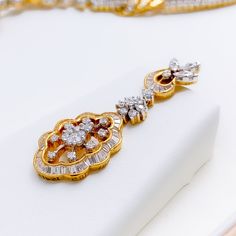 This exquisite 18k gold set, weighing 46.8 grams, features an extravagant floral vine design adorned with dazzling diamonds. The yellow gold finish enhances its luxurious appeal, making it perfect for any special occasion. The set includes a necklace with a total diamond weight of 8.16 carats, featuring F-G color and VS quality diamonds in round and baguette shapes. The necklace has a length of 16.5 inches with a 1.5-inch drop length, adjustable 0.75-inch links, and a secure hook lock. The match Luxury Gold Bridal Necklace For Anniversary, Luxury Yellow Gold Bridal Necklace For Anniversary, Gold Bridal Necklace With Pendant And Elegant Design, Exquisite Yellow Gold Diamond Necklace For Formal Occasions, Elegant Yellow Gold Bridal Necklace With 17 Jewels, Exquisite Gold Diamond Necklace For Formal Events, Luxury Gold Diamond Necklace For Formal Occasions, Luxury 22k White Gold Necklaces, Gold Luxury Bridal Necklace For Formal Occasions