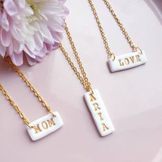 Personalised white clay necklace with gold letters on a gold plated chain.Such a necklace would make great gift for any occasion.To place an order just select type of necklace and leave note in customisation box or message me word/name you would like me to make.You can also leave message in personalisation section with preferable length of the necklace (please see last picture for guide). If there no message I will make necklace 18inch long.If you would like to have few  pendants just message me Handmade White Charm Necklaces For Birthday Gift, Gold Charm Necklaces With Letter Beads For Mother's Day, Customized White Charm Necklace For Gift, Customized White Charm Necklaces For Gift, Personalized White Name Necklace For Mom, Minimalist White Charm Necklace For Personalized Gift, White Custom Name Charm Necklace For Personalized Gift, White Charm Necklace For Valentine's Day Birthday Gift, Customizable White Necklaces For Personalized Gift