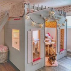 a child's bedroom with a loft bed and stairs