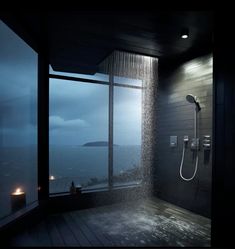 a shower head in the middle of a room with a large window and ocean view