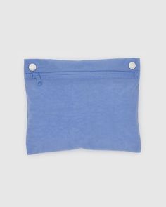 a small blue pouch with two buttons on the front and one button at the bottom