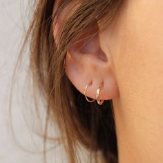 Add some sunny sparkle to your ear with the Tiny Huggie Post Hoop. It's the perfect little pick-me-up for your lobes, crafted from pure 14k gold for a happiness-inducing shimmer. comes with a 14k gold classic earring back sold as a single hoop, unless you select a different quantity from the drop down menu hoops measure 9.7mm in diameter post is 20g these earrings are made entirely out of solid 14k gold, so they are safe for sensitive ears! These are made to order, please check here for updated Classic 14k Gold Stackable Earrings, Stackable Huggie Hoop Earrings Fine Jewelry, Fine Jewelry Stackable Huggie Hoop Earrings, Small Hoop Stackable Fine Jewelry Earrings, Stackable Yellow Gold Huggie Earrings In Sterling Silver, Stackable Small Hoop Earrings Fine Jewelry, Yellow Gold Stackable Huggie Earrings In Sterling Silver, Stackable Small Hoop Earrings In Fine Jewelry, Yellow Gold Sterling Silver Stackable Huggie Earrings