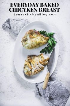 two slices of chicken on a plate with parsley and a knife next to it