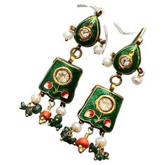 Beautiful vintage 10kt gold , hand - painted Mughal earrings with fresh water cultured pearls , paste stones , coral and emerald beads at bottom . These kundan style jewelry is handmade and is wax filled with gold or silver sheet on top as these earrings . Hand made in northern part of India in mid 20th century . Vintage Kundan Ceremonial Jewelry, Vintage Kundan Jewelry For Ceremonial Occasions, Vintage Chandbali Jewelry For Celebrations, Vintage Ceremonial Jewelry For Festive Season, Vintage Ceremonial Jewelry For Festive Occasions, Vintage Jewelry For Festive Celebration, Festive Bohemian Jeweled Earrings, Vintage Festive Ceremonial Jewelry, Antique Meenakari Jewelry Gift