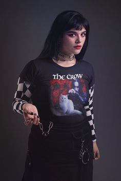 The Crow Cat - 90s Vintage T-Shirt It's made of 100% ring-spun cotton and is soft and comfy. The double stitching on the neckline and sleeves add more durability to what is sure to be a favorite!   * 100% ring-spun cotton * Sport Grey is 90% ring-spun cotton, 10% polyester * Dark Heather is 65% polyester, 35% cotton * 4.5 oz/yd² (153 g/m²) * Pre-shrunk * Shoulder-to-shoulder taping * Quarter-turned to avoid crease down the center * Blank product sourced from Bangladesh, Honduras, Haiti, Mexico, or Nicaragua 90s Crew Neck T-shirt For Alternative Fashion, 90s Style Crew Neck T-shirt For Alternative Fashion, Alternative Style Crew Neck Top With Sublimation Print, The Crow, Aesthetic Shirts, All Black Everything, Ladies Tee Shirts, Indie Outfits, Reborn Dolls