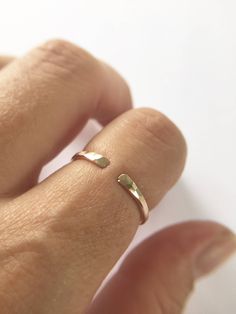 "Simple everyday 14k gold filled cuff ring perfect for everyday use. Perfect for stacking, hammered for texture and shine The hammering process leaves tiny facets on the bars that catch light and sparkle as you wear it. HANDMADE item not manufactured so every piece has it's own uniqueness Made when ordered Link back to my shop: https://www.etsy.com/shop/TayTayInspired Each ring has been hand crafted by me and hammered and polished for a beautiful finish! These rings are \"Made to Order\" and are Delicate Adjustable Open Midi Rings, Delicate Adjustable Open Band Midi Rings, Adjustable Open Bypass Ring For Promise, Adjustable Open Bypass Promise Ring, Adjustable Open Band Midi Rings For Weddings, Adjustable Midi Rings For Wedding, Dainty Adjustable Open Midi Rings, Adjustable Dainty Open Midi Ring, Adjustable Dainty Midi Open Ring