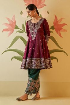 Wine anarkali with floral gotta, silken threads and mirror work, zari embroidery. Paired with embroidered pant and embroidered dupatta.
Components: 3
Pattern: Embroidered
Type Of Work: Floral
Neckline: Round
Sleeve Type: Three quarter
Fabric: Silk, Lining: Crepe
Color: Wine
Other Details: 
Attached lining
Scallop border dupatta
Note: All the jewellery worn by the model is for styling purpose only
Occasion: Wedding - Aza Fashions Traditional Jamawar Dress With Mirror Work, Semi-stitched Jamawar Sharara With Gota Work, Anarkali Style Sharara With Gota Work In Jamawar, Semi-stitched Jamawar Lehenga With Mirror Work, Traditional Jamawar Lehenga With Mirror Work, Jamawar Dresses With Mirror Work For Festivals, Anarkali Style Dola Silk Sharara With Mirror Work, Festive Anarkali Set With Gota Work In Jamawar, Anarkali Lehenga In Jamawar With Mirror Work