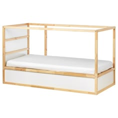 the bed frame is made out of wood and white canvas