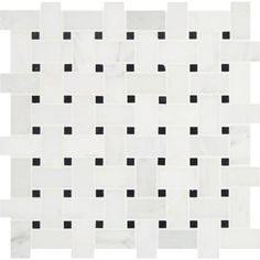 a white and black tile with squares on it