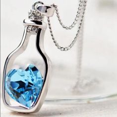 Brand New Pendant Heart Necklace Enclosed In A Bottle. Stone Material Is Made Out Of Alloy. Chain Length Is Approximately 37cm, And Pendant Size Is Roughly 3.5cm. Blue Heart Necklaces For Party, Runway Necklace, Fluorite Necklace, Blue Crystal Necklace, Large Pendant Necklace, Silver Diamond Necklace, Pendant Heart, Blue Accessories, Stone Material