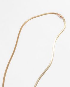 Forever glistening under the light, the Hera herringbone chain will catch any eyes laid on her. Made in 18K gold fill, she's tarnish-resistant, waterproof, and safe for sensitive skin.