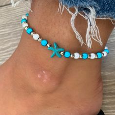 🌸 turquoise, white and silver miracle bead anklet with starfish charm 🌸  ♥️Catches the light to give off a glow!  ♥️Perfect for nights out or even holidays!  ♥️Please message me if you have any questions each  ♥️ Made on rope so they are self tie at each end making it adjustable to you own size The colour may vary slightly due to most images being taken under direct sunlight or with flash to show you the full effect of the beads x White beads may appear grey/silver when opened in a dark room. The full effect of the beads will shine through in different lights. Please note: Buyer pays for any return postage/ exchange postage x Blue Starfish Charm Anklet For Vacation, Blue Anklet With Starfish Charm For Vacation, Silver Starfish Beaded Bracelet Gift, Blue Anklets With Starfish Charm For Gift, Blue Anklets With Starfish Charm As Gift, Silver Starfish Shaped Beaded Bracelet Gift, Blue Starfish Charm Anklet For Summer, Turquoise Anklets With Starfish Charm For Beach, Blue Anklet With Starfish Charm For Summer