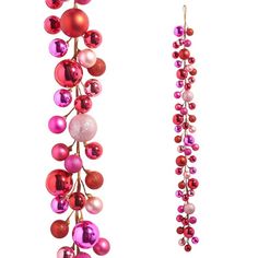 pair of pink and red ornaments hanging from long gold - plated earwires