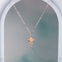 This exquisite rose pendant necklace showcases a 3D rose in 925 sterling silver with rose gold plating for a stunning flower color. It hangs delicately on a 925 sterling silver cable pendant with an adjustable ball. Make this elegant rose pendant necklace a part of your everyday fine jewelry collection, or gift it to a loved one for a special occasion. Materials: 925 sterling silverFinish: platinum plate, rose gold plateMaximum length is 17.5 inches, can be adjusted shorter using the adjustable ball. Jewelry Care: See more information about how to care for your jewelry here. Shipping Policy: Orders will be shipped within 1-3 business days. Economy shipping will take 7-14 days to arrive and standard shipping is 1- 4 days for U.S. orders. International shipping time is depended on the countr Sterling Silver Necklace With Rose Flower Pendant, Rose Pendant Necklace In Sterling Silver, Sterling Silver Rose Gold Jewelry With Rose Design, Elegant Rose Sterling Silver Necklace, Ball Jewelry, Rose Pendant Necklace, 3d Rose, Rose Pendant, Sterling Silver Necklace Pendants