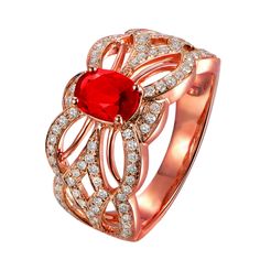 a ring with a red stone surrounded by diamonds