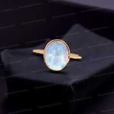 Bezel Set Moonstone Ring 14K Gold Rainbow Moonstone Ring Natural Gemstone Anniversary Gift for Her Unique Jewelry Solitaire Stacking Ring Welcome to Shreenathjewelry JUST OPENED- Experience beautiful jewelry that complements your everyday style, and completes your look. Our jewelry is so stunning, and so you are. Ring description Primary Stone:- Moonstone (Natural) Stone Shape:- Oval Stone Size:- 8x10 MM Stone Color:- Blue Fire  Jewelry Type: Stacking Ring Method: Cast Personalization: Possible Occasion: Engagement Ring Size: We make rings from US 4 to US 10. (If you need smaller or bigger ring size, please ask me to resize) Country of Manufacture: India All our work is custom made by hand with Love and Care in our workshop ♥ CUSTOM ORDERS Please let us know if you want any customization o Spiritual Oval Stackable Moonstone Ring, Spiritual Oval Moonstone Stackable Ring, Celestial Style Oval Cabochon Gemstone Ring, Celestial Oval Cabochon Gemstone Rings, 14k Gold Moonstone Cabochon Ring For Anniversary, 14k Gold Moonstone Ring For Anniversary, Yellow Gold Moonstone Gemstone Rings, Yellow Gold Moonstone Rings With Gemstones, Spiritual 14k Gold Moonstone Ring For Anniversary