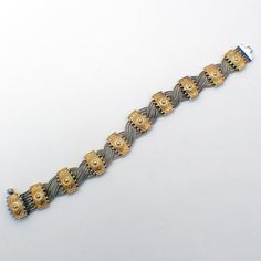 "Vintage wide braided design sterling silver chain bracelet, decorated with ornate gilt embossed stations. This beautiful bracelet is 7 3/4\" long, 5/8\" wide and weighs 43.9 grams or 1.41 ozs Troy. EA2888" Ornate Gold Bracelet, Ornate Gold Sterling Silver Bracelet For Formal, Ornate Gold Sterling Silver Bracelet For Formal Occasions, Large Bracelet, Braid Designs, Shell Ring, Chunky Beads, Silver Chain Bracelet, Watch Chain