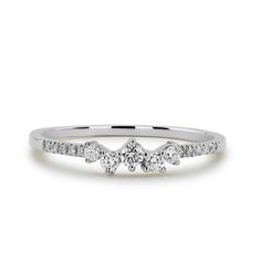 a white gold engagement ring with three diamonds