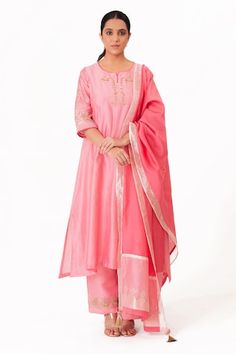 Lotus pink A-line kurta with embroidery along the neckline and sleeves. Paired with a pant and tissue applique work dupatta. - Aza Fashions Bollywood Style Anarkali Set With Embroidered Neckline For Eid, Festive Bollywood Anarkali Set With Embroidered Neckline, Festive Anarkali Dupatta With Embroidered Neckline, Festive Dupatta With Embroidered Neckline For Eid, Eid Festive Dupatta With Embroidered Neckline, Pink Palazzo Set With Embroidered Border And Straight Kurta, Diwali Traditional Wear Straight Kurta With Embroidered Neckline, Bollywood Style Embroidered Salwar Kameez For Wedding, Bollywood Style Embroidered Wedding Salwar Kameez