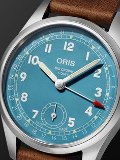 Launched in 1938, Oris' 'Big Crown' watch was first designed for aviators to easily operate while wearing gloves. This model is powered by a new hand-wound calibre 473 movement with a five-day power reserve that’s visible through its exhibition case back. Its classic leather strap fastens with a sophisticated folding clasp that complements its sleek stainless steel case. For warranty information, please refer to details & care Classic Blue Chronograph Watch With Date Indicator, Vintage Blue Watch With Tachymeter, Blue Round Watch With Tachymeter, Vintage Blue Watch With Analog Display, Vintage Blue Chronometer Watch, Oris Big Crown, Oris Watches, Big Crown, Hand Wound