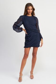 Sophisticated, exclusive, and elegant, this long-sleeved mini dress features intricate ruching for a truly stunning and luxurious look. Perfect for any occasion, this dress will make you feel like a work of art, combining fashion and luxury in one stunning piece. Round neckline Balloon sleeved Dress silhouette Mini dress length Runched design Fabric Contents: 100% Polyester Lining: 100% Polyester Model wears small sizeModel's height 5'9" Long Sleeve Dress With Draped Sleeves For Fall Party, Elegant Mini Dress With Gathered Sleeves, Navy Dress For Fall Party, Elegant Mini Dress With Gathered Sleeves For Formal Occasions, Elegant Mini Dress With Gathered Sleeves For Formal Events, Chic Long Sleeve Dress With Gathered Sleeves For Party, Long Sleeve Mini Dress With Draped Sleeves For Work, Elegant Evening Mini Dress With Long Draped Sleeves, Mini Dress With Draped Long Sleeves For Night Out