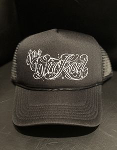 "Wicked Trucker Hats!  Your choice of all black \"Stay Wicked\" logo or the black & white \"Wicked Tooth Gems & Piercing\" logo  One size fits all Unisex" Black Hat With Logo Print And Flat Brim, Black Trucker Hat With Letter Print And Flat Bill, Black Baseball Cap With Logo For Streetwear, Black Hip Hop Hat With Letter Print, Black Snapback Baseball Cap With Letter Print, Black Logo Print Baseball Cap For Streetwear, Urban Black Snapback Hat With Letter Print, Black Letter Print Hip Hop Hat, Urban Black Trucker Hat With Letter Print