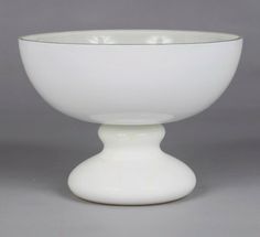 a white bowl sitting on top of a table