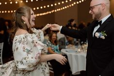 a man in a tuxedo is feeding a woman with a piece of cake