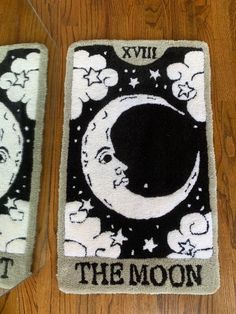 two rugs with the moon on them are sitting on a wooden floor next to each other