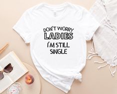 "Don't Worry Ladies I'm Still Single Shirt, Funny Men Shirt, Sarcastic Single Shirt, Single Saying Tee, Funny Tee, Shirt For Men, Single Tee Welcome to my BEB Tee Design store!  In my shop, you will find high quality Bella Canvas Brand T-Shirt. My shirts are soft and regular relax fit.  Hey! Don't forget to see the drop-down menus for the sizes and colors that you would like to order.  And it is so important to check the size charts in the listings.  These are the information below about my prod Single Shirt, Still Single, Funny Men, Men Shirt, T Shirts With Sayings, Funny Tees, Man Humor, Size Charts, Shirts With Sayings