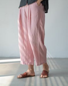 "Stay cool and comfortable this summer with our lightweight linen cropped pants. These simple and relaxed wide-leg pants are perfect for the warm weather. Crafted from breathable linen fabric, they offer a loose and airy fit that allows for easy movement. The cropped length adds a trendy touch, while the wide-leg design provides a relaxed and laid-back vibe. Whether you're lounging at home or strolling along the beach, these pants are a must-have for your summer wardrobe. Embrace simplicity and style with our summer linen cropped pants. SIZE LIST Normal: Waist:72CM/28.3\" Hips:112CM/44.1\" length:90CM/35.4\" Shipping Policies: All orders will take the fastest express delivery no extra shipping. Usually 10-15 days to arrive US. To Europe usually 8-12 days. Other countries usually 10-15 days Relaxed Straight Harem Pants For Spring, Relaxed Baggy Harem Pants For Spring, Relaxed Fit Wide-leg Summer Capris, Pink Relaxed Fit Linen Bottoms, Summer Loose Fit Wide-leg Capris, Relaxed Baggy Bottoms For Summer, Relaxed Spring Harem Pants, Ankle-length, Relaxed Spring Ankle-length Harem Pants, Relaxed Pink Bottoms For Summer