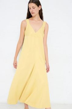 Slip dress made from a fluid viscose crepe. Features thick straps, a deep v-neckline and an asymmetric pleat at front. Color: Butter (Yellow) Material: 83% Viscose, 17% Virgin Wool Regular fit Natalie is 5'10" and wears a UK10. Spring A-line Midi Dress With Bias Cut, Sleeveless Silk V-neck Dress For Summer, Summer A-line Bias Cut Slip Dress, Silk V-neck Summer Dress, Asymmetrical Silk Slip Dress For Spring, Chic Viscose V-neck Slip Dress, Chic V-neck Slip Dress In Viscose, Chic V-neck Viscose Slip Dress, Chic V-neck Viscose Dress For Summer