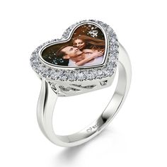 Share with the world a picture of your life, whether of a special moment or the ones you love with this personalized sterling silver heart-shaped ring. With your photo included, you can take it to any occasion you want and make it memorable.Material: Plating Color: Silver White Heart Ring With Brilliant Cut As Gift, Personalized Heart Ring For Anniversary, Silver Heart Cut Ring For Anniversary Gift, Silver Heart Cut Ring For Anniversary, White Gold Heart Cut Rings For Anniversary Gift, Personalized Sterling Silver Heart Ring, Personalized White Heart Ring For Valentine's Day, Personalized Sterling Silver Heart Ring Fine Jewelry, Valentine's Day Halo Ring As A Gift