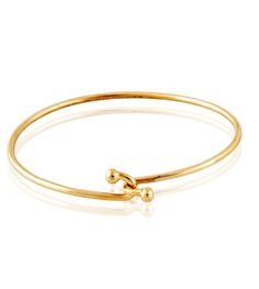 Our delicate handmade bracelet with the double ball closure is a favorite worn alone or with our Skinny Galaxy, Cabochon Spring Gold or Monogram Bangle. Standard size is 6.5. Please inquire if you need a custom size. Excellent gift for MEN too! Dimensions: 3.5MM Gold Wire 14kt Gold Handmade in Beverly Hills Classic Adjustable Gold Bracelet, Adjustable Yellow Gold Round Cuff Bracelet, Elegant Adjustable Hoop Gold Bracelet, Adjustable Hoop Jewelry For Formal Occasions, Formal Adjustable Hoop Jewelry, Adjustable Round Gold Bracelet In Modern Style, Adjustable Round Bangle For Formal Occasions, Modern Adjustable Gold Bracelet, Adjustable Formal Bangle