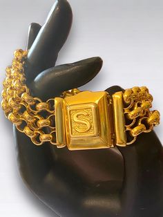 "Spectacular CUSTOM Vintage 14K SOLID Gold LOCKET Initial S Triple Rolo Bracelet In gorgeous vintage condition Custom made 14k Italian gold vintage bracelet! No one else will have it!! * Crafted beautifully in 14k yellow gold, bracelet measures approximately 7.5\" long laying flat, end to end and approximately 21mm wide!! * 37.5 grams of 14k gold! * Unique Locket box closure with the letter \"S\", measures a little under 1\" * Three (3) Rolo link chains each measuring approximately 7mm wide * Co Vintage Yellow Gold Bracelets Stamped 14k, Vintage Yellow Gold Bracelet With Box Clasp, Vintage Yellow Gold Bracelet With Gold Clasp, Collectible Gold Jubilee Bracelet, Vintage Yellow Gold Bracelets, Vintage Yellow Gold Bracelet With Clasp, Vintage Hallmarked Gold Bracelet For Anniversary, Vintage Gold Bracelet With Box Clasp, Classic Yellow Gold Collectible Bracelet