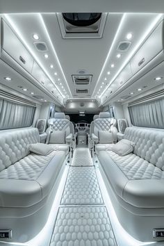 the interior of a luxury vehicle with white leather seats and lights on either side of the car