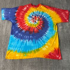 Vintage 90s Tie Dye Basic Blank Essential Streetwear Made in USA Single Stitch Multi Color T Shirt Double Extra Large Mens Condition:  Excellent Used Condition  = No Flaws Measurements: Please see photos above for all measurements IF YOU BUY TWO OR MORE ITEMS USE THE CODE BUNDLE @ CHECK TO SAVE 20% WE SHIP WITHIN 24 HOURS AFTER PURCHASE! Please be aware that we do not offer free returns!! The Buyer is responsible for the cost of the return label.  Follow us on TikTok & Instagram @findsnostalgic Retro Rainbow T-shirt For Summer, Colorful Casual Crew Neck Shirt, Retro Tie-dye Short Sleeve Tops, Retro Tie Dye Short Sleeve Top, Casual Rainbow Crew Neck Shirt, Casual Rainbow Tops, Retro Tie-dye Crew Neck Top, Retro Rainbow Short Sleeve T-shirt, Retro Rainbow Colored Short Sleeve T-shirt