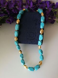 Elegant choker necklace with light blue turquoise stones in an octagonal shape with decorated elements in golden brass. Measures length 54 cm. Gold Turquoise Necklace With Faceted Beads As Gift, Elegant Choker, Turquoise Statement Necklace, Real Turquoise, Bib Necklaces, Turquoise Stones, Blue Turquoise, Turquoise Stone, Stone Necklace