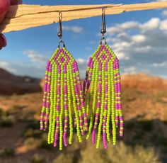 Handcrafted seed bead earrings, made by hand in our Colorado jewelry studio.  Purple and Green Beaded Fringe Earrings. Hand Crafted using glass seed beads. Stainless steel hook ear wires. Southwest, Western and Desert boho style. Limited Edition. Check out our other styles and follow us on Instagram to see what is new @monstera_metalworks Desert Jewelry, Earrings Handmade Boho, Desert Boho, Boho Desert, Beaded Fringe Earrings, Jewelry Hand, Jewelry Studio, Western Jewelry, Southwestern Style