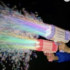 a person using a blow dryer on fireworks