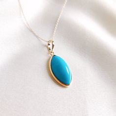 This stunning pendant is set in 14K Solid Yellow Gold with Natural Sleeping Beauty Arizona Turquoise with utmost precision. It is an unique gemstone pendant for nearly every occasion and is completely hassle-free jewelry. 🔷ABOUT GEMSTONE: Turquoise is a vibrant and highly valued gemstone that has been used for its beauty and perceived metaphysical properties. Turquoise is believed to provide protection against negative energies and harmful influences. It is thought to act as a shield, helping t Luxury Turquoise Pendant Necklace, Elegant Turquoise Cabochon Pendant Necklace, Elegant Turquoise Cabochon Necklace, Turquoise Gemstone Pendant Necklace, Fine Jewelry Turquoise Pendant Necklace, Fine Jewelry Turquoise Pendant Necklace Gift, Elegant Turquoise Oval Pendant Jewelry, Blue Turquoise Gemstone Necklace Fine Jewelry, Fine Jewelry Turquoise Pendant