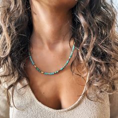 This necklace combines the vibrant spirit of African turquoise with the elegance of crystal beads and gold-plated accents, creating a timeless and versatile piece. Perfect for lovers of boho-chic style, this handmade accessory is designed to bring a sense of calm and creativity to every outfit. - Handcrafted with high-quality natural gemstones and durable and long-lasting gold-plated accents - Features African turquoise, Crystal beads - Adjustable fit for comfortable wear between 44 cm to 49 cm Adjustable Turquoise Necklaces With Gold Beads, Adjustable Turquoise Necklace With Gold Beads, Adjustable Gold Turquoise Necklace With Colorful Beads, Gold Turquoise Necklace With Colorful Beads As Gift, Gold Turquoise Necklace With Round Beaded Details, Turquoise Beaded Necklaces With Spacer Beads, Turquoise Beaded Necklace With Spacer Beads, Turquoise Beaded Necklaces For Healing, Bohemian Gold Turquoise Necklace With Colorful Beads