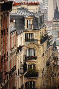 many buildings with balconies on the top and bottom floors in paris, france