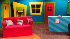 a brightly colored living room with furniture and decor