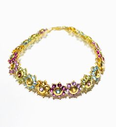 This is a beautiful multi-color flowers bracelet with different types of stones. Precious Metal: 14 Karat Yellow Gold. Gemstone: Garnet,Amethys,Pink Amethys,Topas,Aquamarine,Peridot Stones. Available Size: Length: 7.5 inches. Width: 9.9 mm. Available Weight: ~13.1 grams* May be available in other sizes. Please inquire. *All weights are approximate. **Pendant sold separately. Please contact us if you have further questions about alternate sizes or styles, availability, specifications, and persona Multi Colored Flowers, Peridot Stone, Types Of Stones, Flower Bracelet, Precious Metal, Precious Metals, Different Types, Aquamarine, Garnet