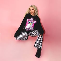 Add a slight Furby touch to any outfit with our Furby Raglan Sweater. This cool design is perfect for any fan looking for a more understated look. Featuring a big graphic of a pink Furby on the front, complete with the Furby logo, this black unisex raglan sweater will keep you warm and stylish all year round. -Screen printed - 60% Cotton / 40% Polyester -Unisex Fit - Officially Licensed Furby x Cakeworthy Product Male Model: Size XL Female Model 1: Size XL Female Model 2: Large Female Model 3: M Raglan Sweater, Female Model, Cool Design, Male Model, Cool Designs, Crew Neck, Fan, Black