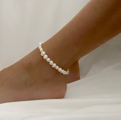 - Comes in 9 or 10 inches - Perfect for stacking on ankle or wearing individually - Ready Wear Quantity : 1 Piece Material : Freshwater Pearl, Beading Wire, Metal Clasp Size: 9 inch or 10 inch Surface : Smooth Please ask for larger quantities if would like more than what is currently listed! ★ Shop Bulk Discount Codes★ -Spend $50-$100 get 10% OFF Use Code: BEAD10 -Spend $101-$150 get 15% OFF Use Code: BEAD15 -Spend $151-$200 get 20% OFF Use Code: BEAD20 -Spend $201 and above get 25% OFF Use Code Adjustable Pearl Anklets For Summer, White Pearl Anklets For Summer, Summer White Pearl Anklets, Adjustable Beaded Pearl Anklets, Adjustable White Pearl Anklets, Elegant Summer Anklets With Round Beads, Beaded Ankle Wrap Anklet, How To Wear Pearls, Pearl Ankle Bracelet